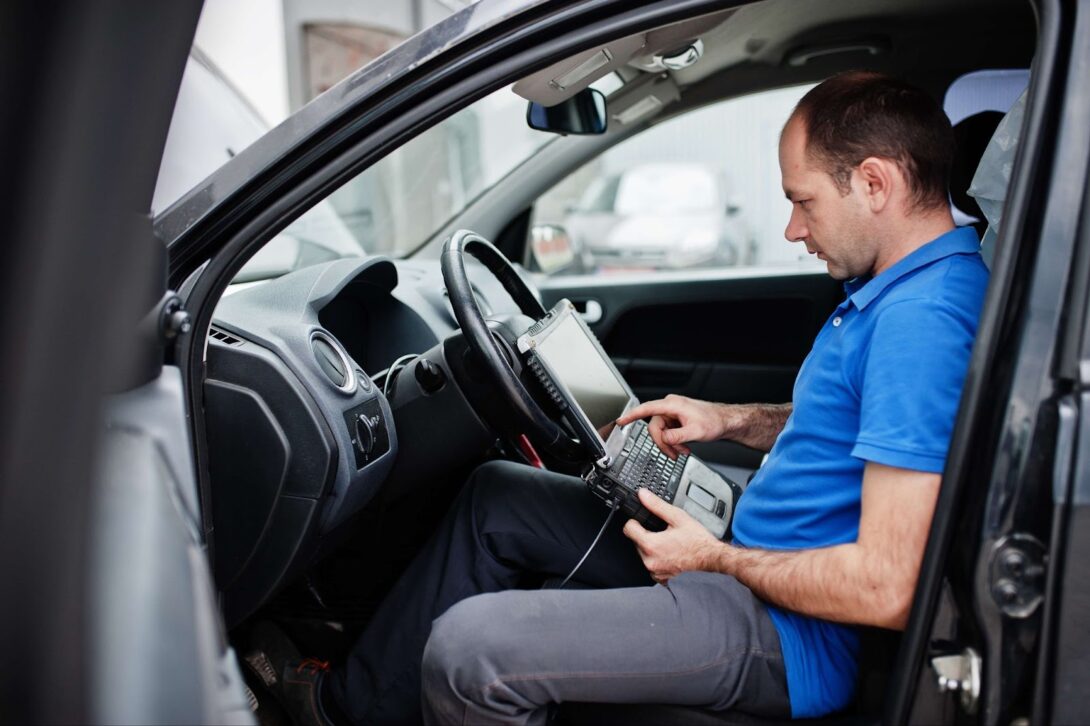 A man fixing a car