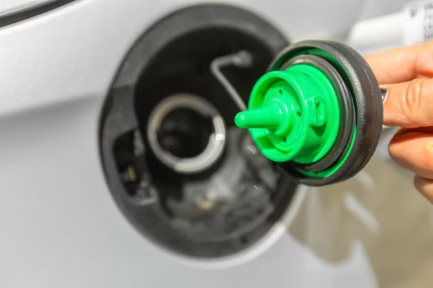 Close-up shot of a removed fuel cap from a car