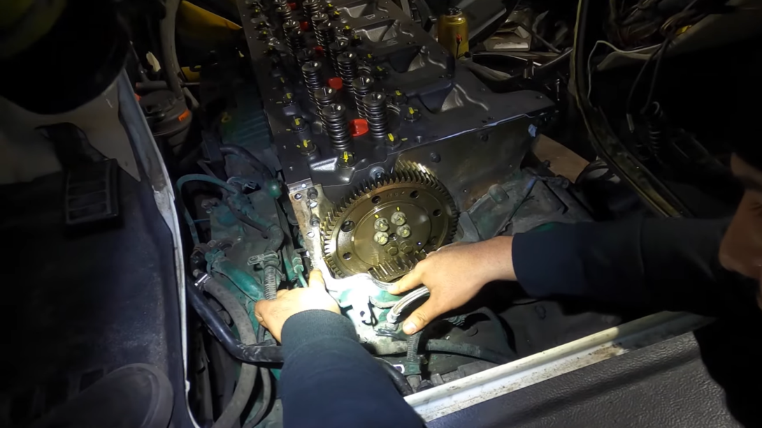 man repairing the car engine